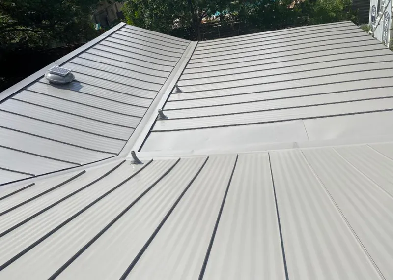 Solar attic fan installed on a metal roof for Roof Ventilation in Lakeland Highlands